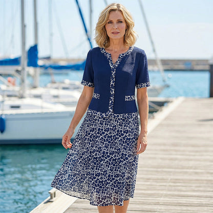 💥50% árcsökkentés🧥💼 Divatos, két részesnek tűnő egyberuha🌸✨ A-vonalú virágmintás ruha – a könnyed elegancia maga, minden testalkatra!